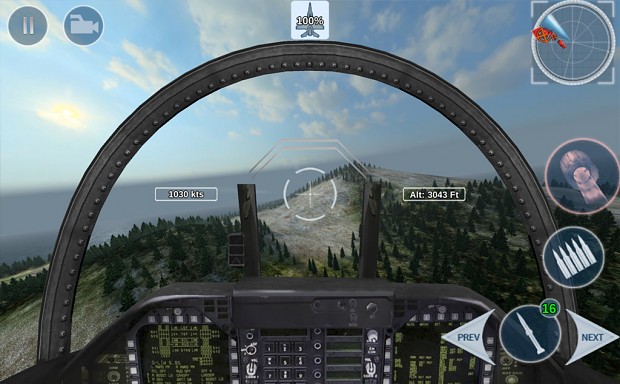 F-18 cockpit view over terrain and vegetation.